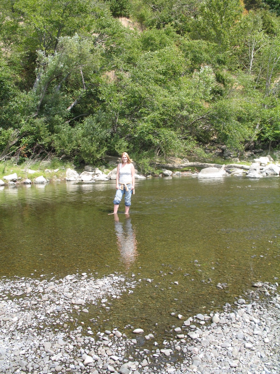 Leigh standing in a river