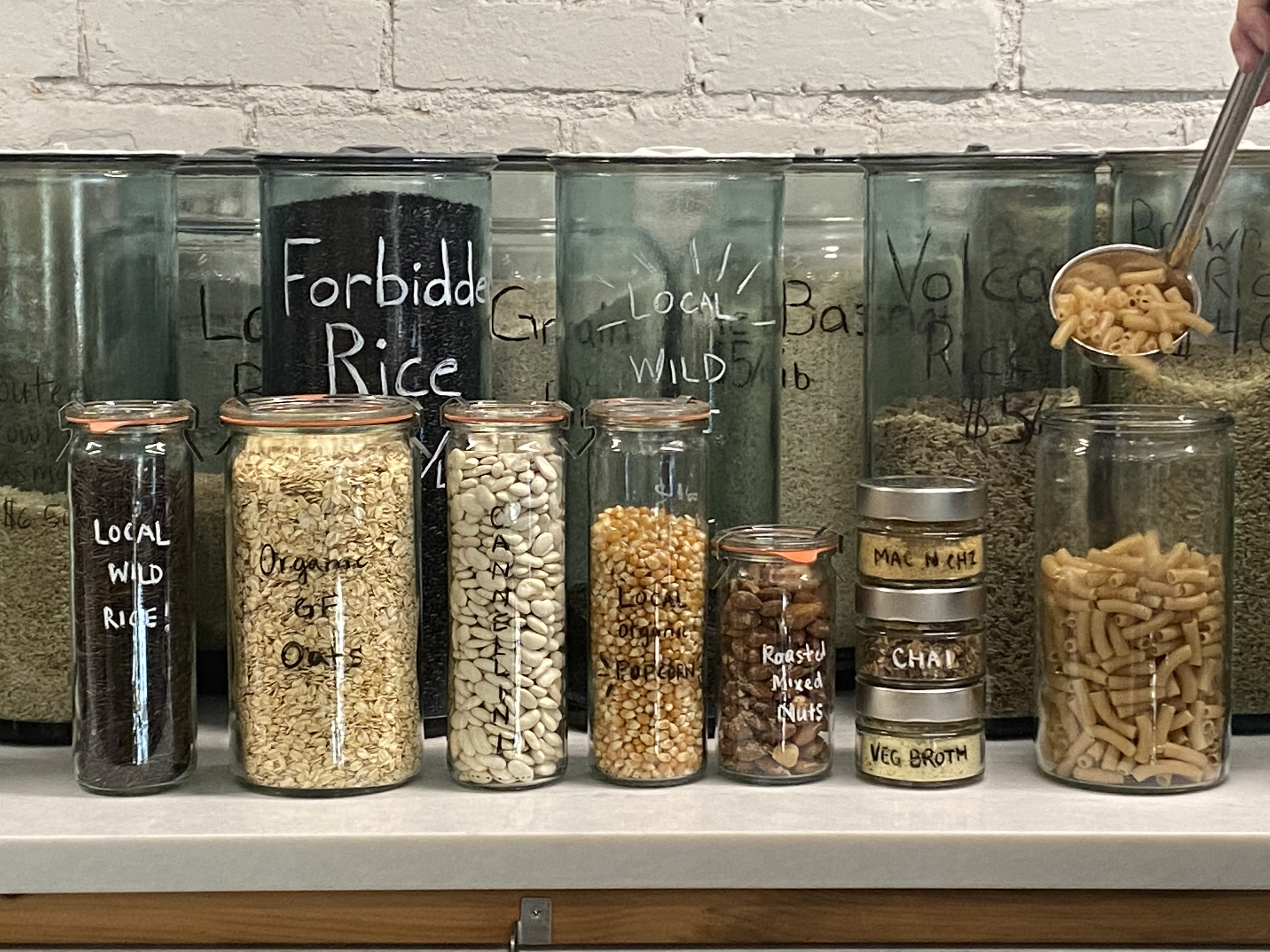 Grains, spices, and refill stations in glass and stainless