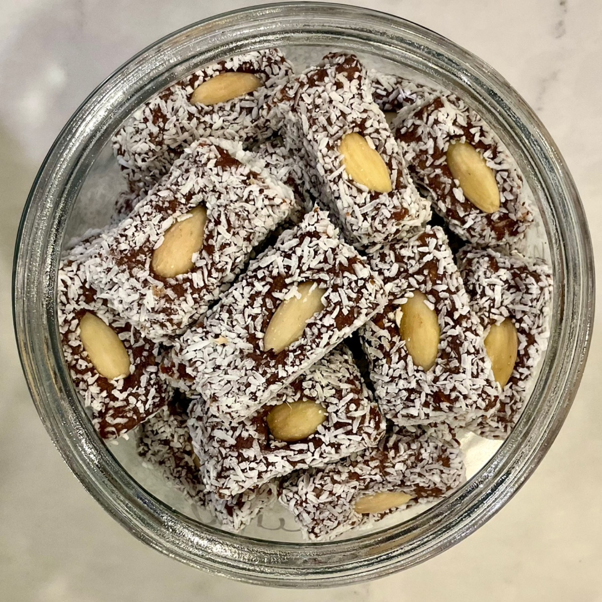 Hummingbird Wholesale Date Rolls, with Almonds and Coconut organic deglet noor dates are ground
